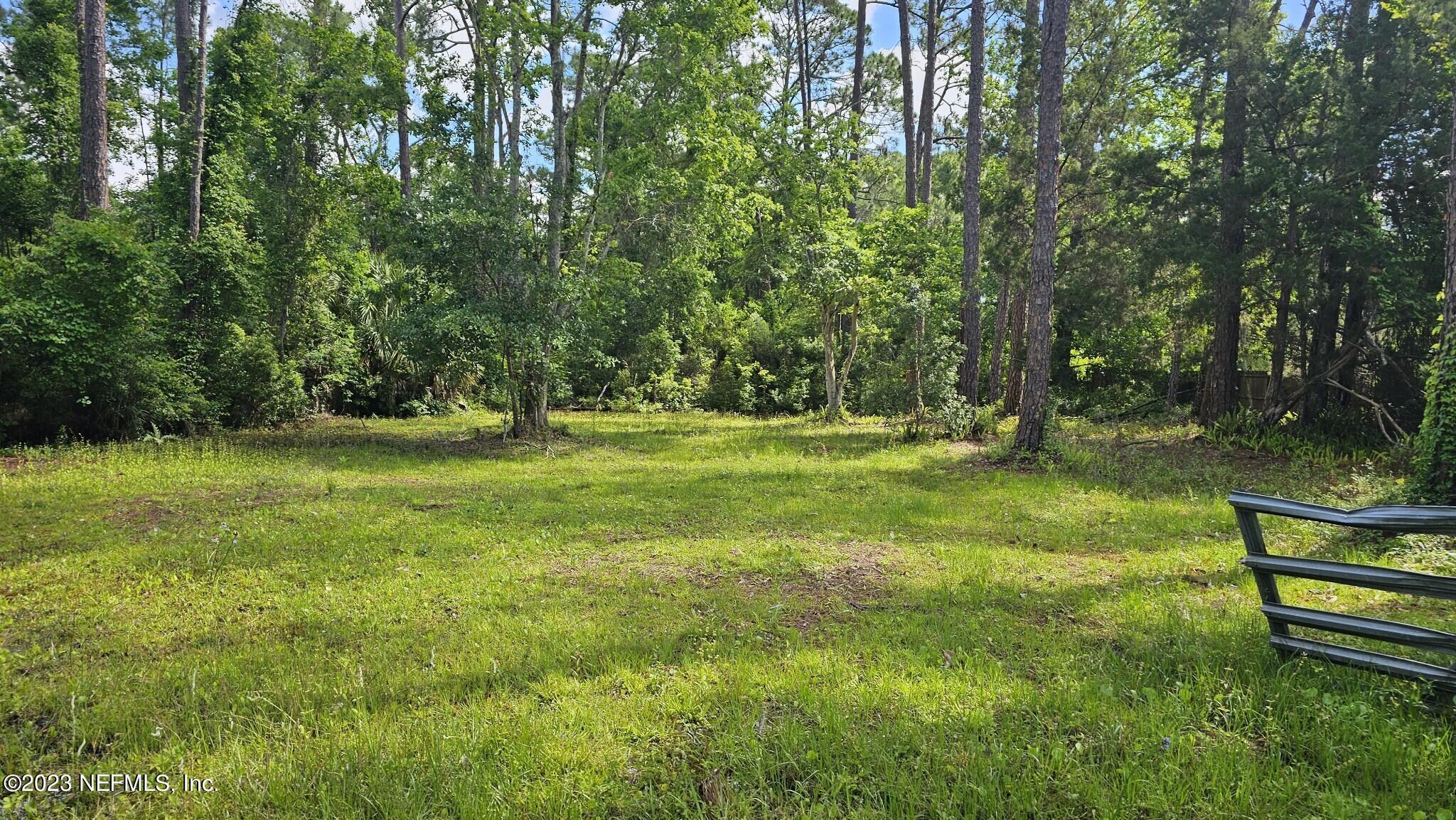 150 Venetian Boulevard St. Augustine, FL 32095 - Photo 10 of 17 a view of outdoor space with deck and yard