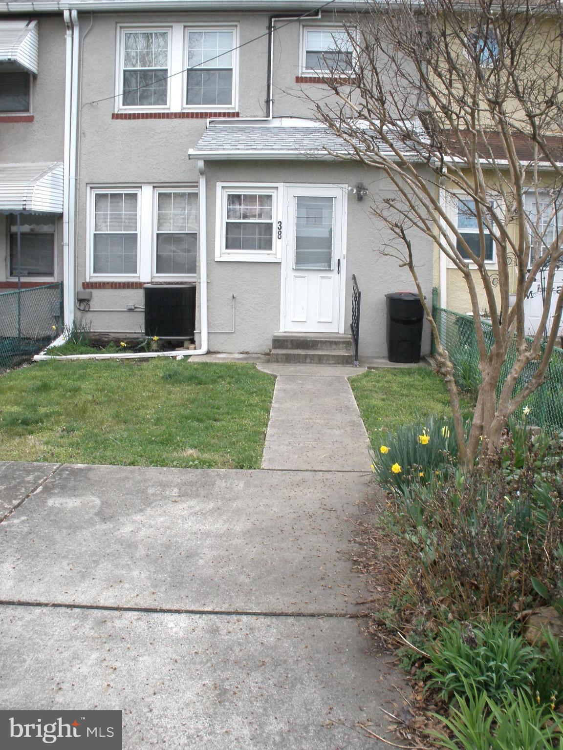38 Kinship Road Baltimore, MD 21222 - Photo 38 of 38 a front view of a house with a garden and yard