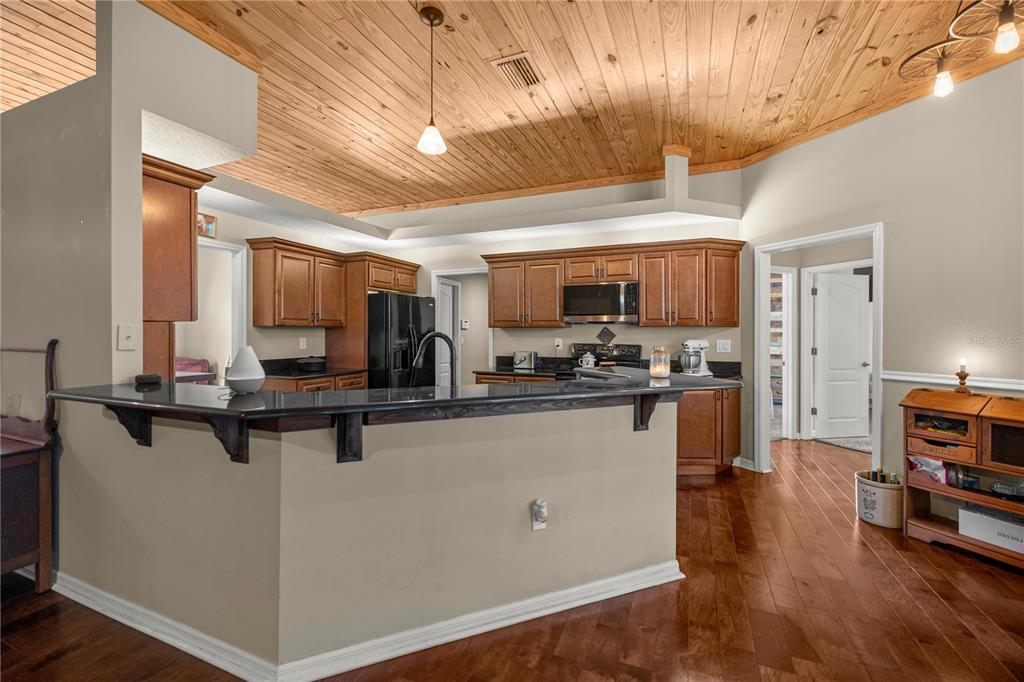 3030 South Bay Berry Point Inverness, FL 34450 - Photo 12 of 48 a kitchen with lots of counter top space and appliances