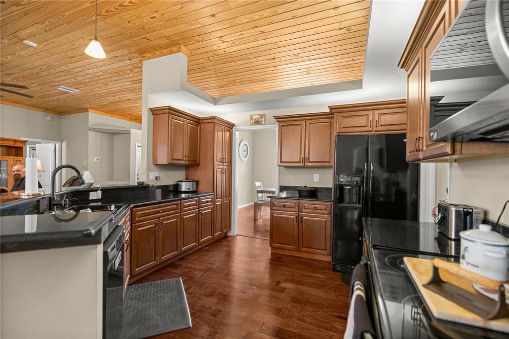 3030 South Bay Berry Point Inverness, FL 34450 - Photo 16 of 48 a kitchen with stainless steel appliances granite countertop a sink stove and refrigerator