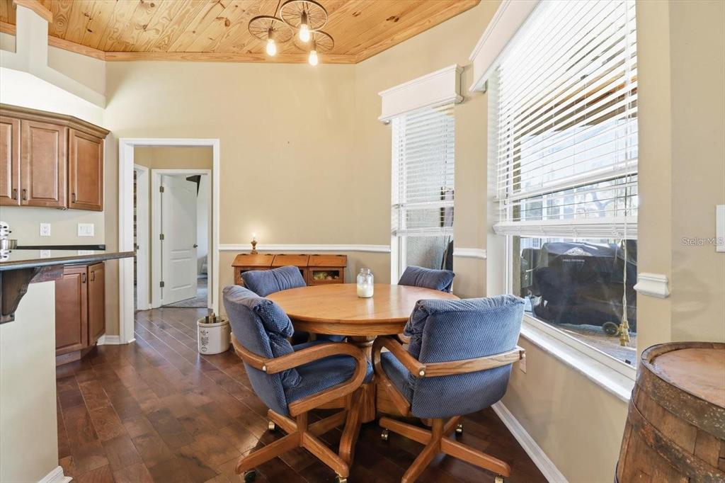 3030 South Bay Berry Point Inverness, FL 34450 - Photo 19 of 48 a view of a dining room with furniture and a window