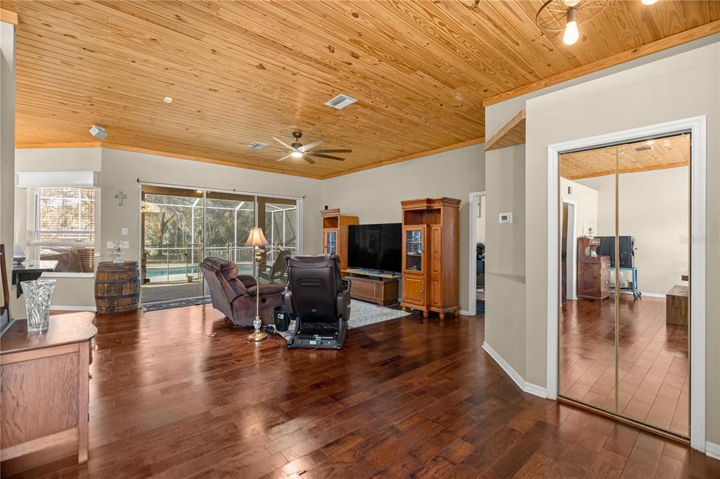 3030 South Bay Berry Point Inverness, FL 34450 - Photo 21 of 48 a dining room with furniture and wooden floor