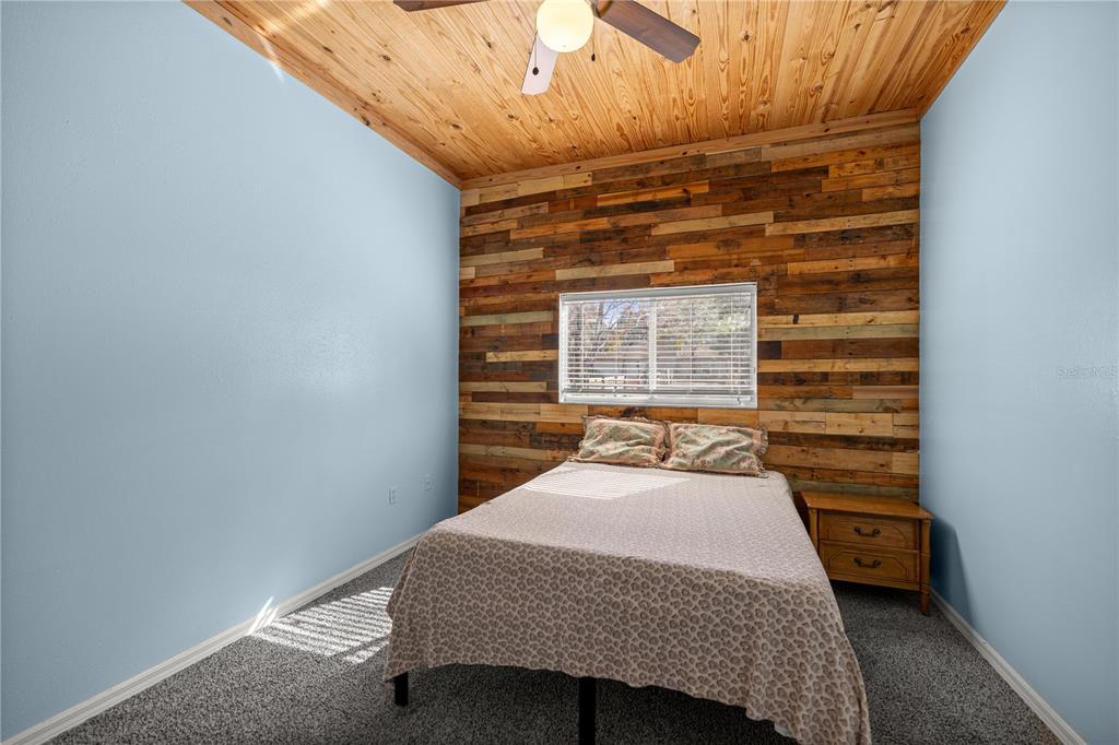 3030 South Bay Berry Point Inverness, FL 34450 - Photo 29 of 48 a bedroom with a bed and wooden floor