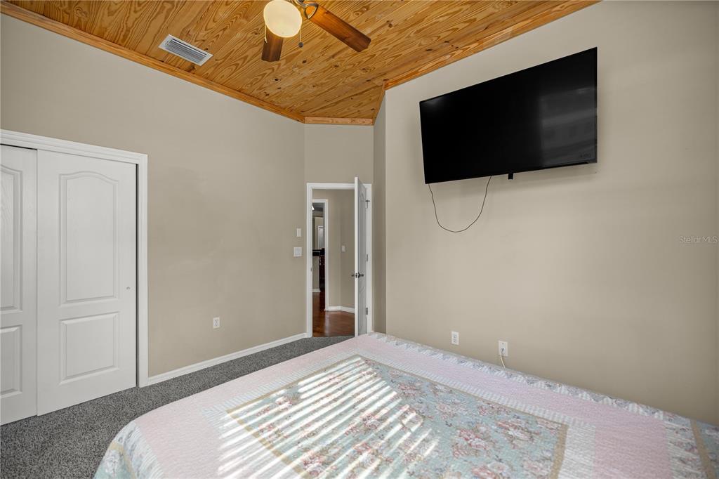 3030 South Bay Berry Point Inverness, FL 34450 - Photo 31 of 48 a bedroom with a flat screen tv