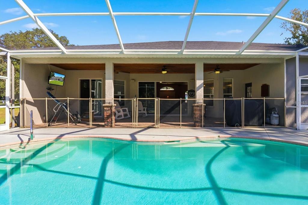 3030 South Bay Berry Point Inverness, FL 34450 - Photo 39 of 48 a view of a house with a backyard porch and sitting area