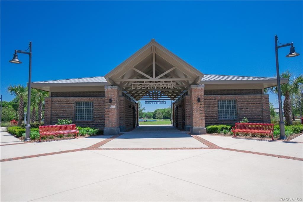 3030 South Bay Berry Point Inverness, FL 34450 - Photo 45 of 48 a front view of a house with garage and plants