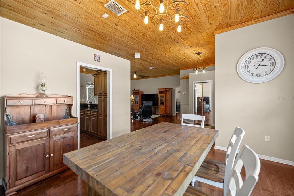 3030 South Bay Berry Point Inverness, FL 34450 - Photo 10 of 48 a kitchen with a table and chairs