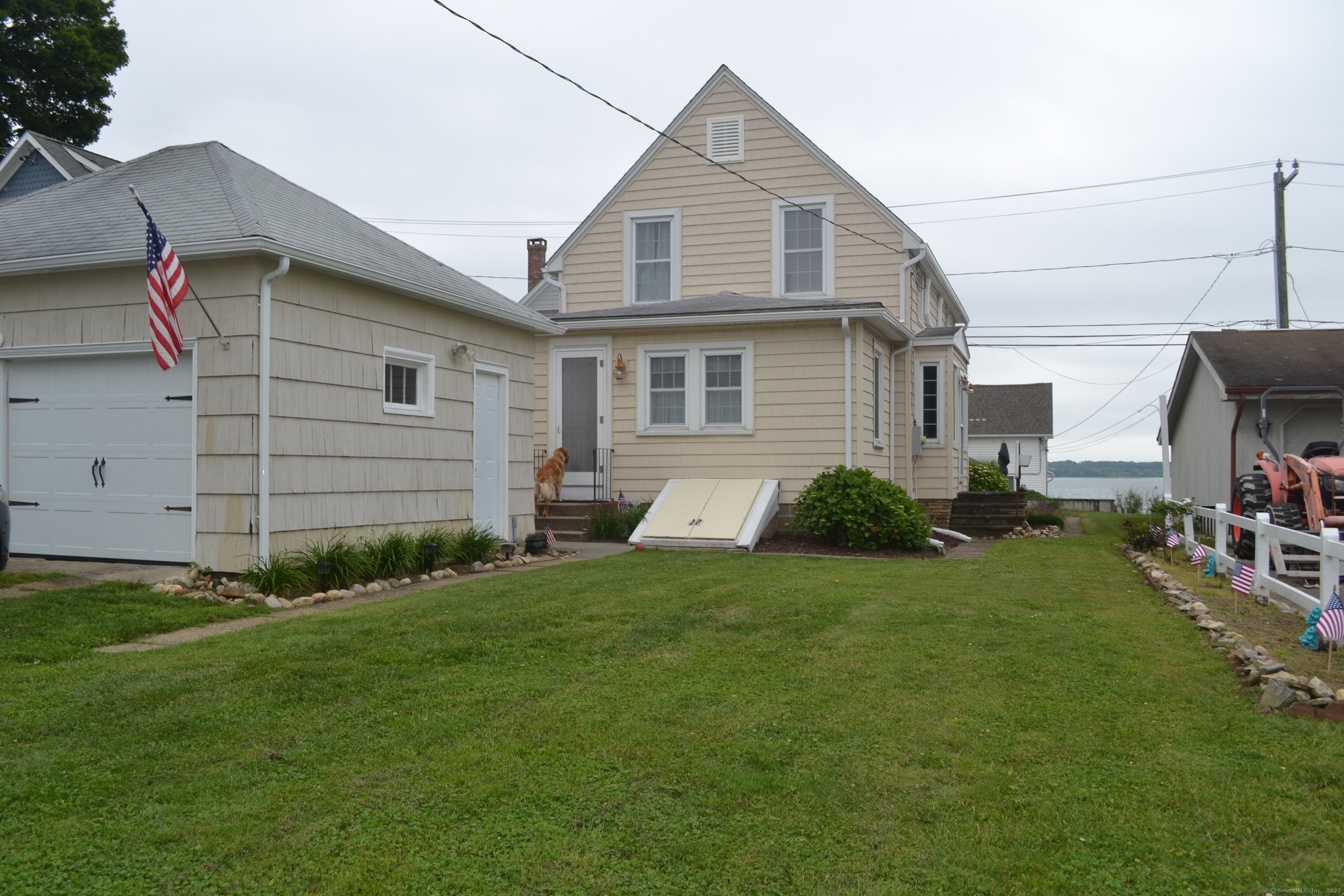 110 Columbus Avenue East Lyme, CT 06357 - Photo 1 of 24 a view of a house with a yard