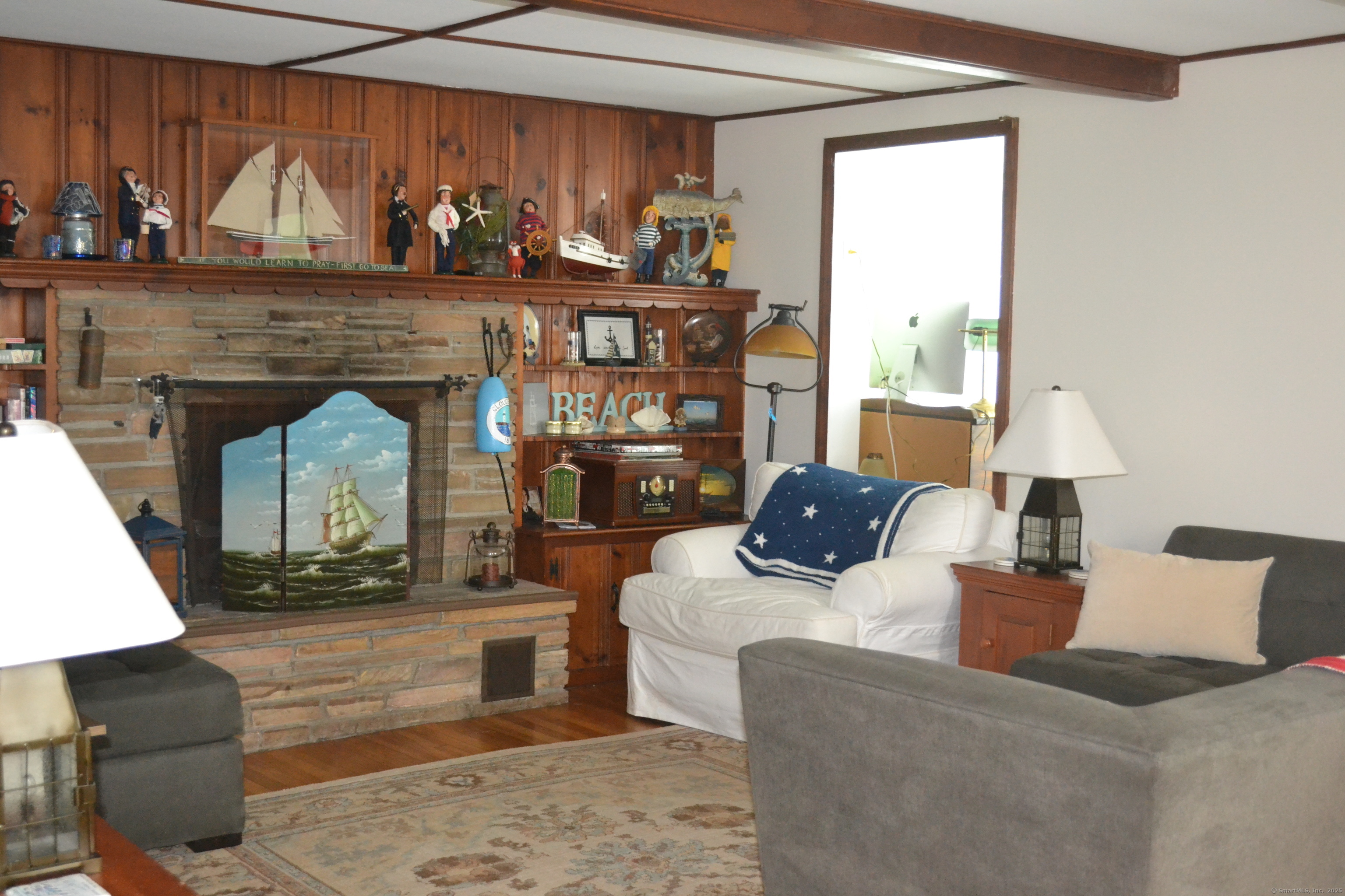 110 Columbus Avenue East Lyme, CT 06357 - Photo 16 of 24 a living room with furniture and a fireplace