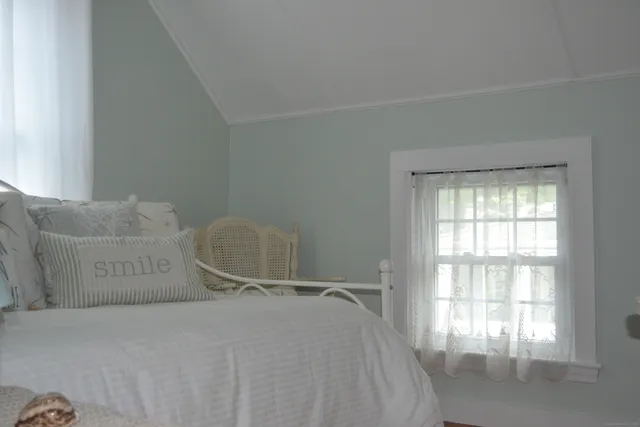 a view of a balcony with wooden floor