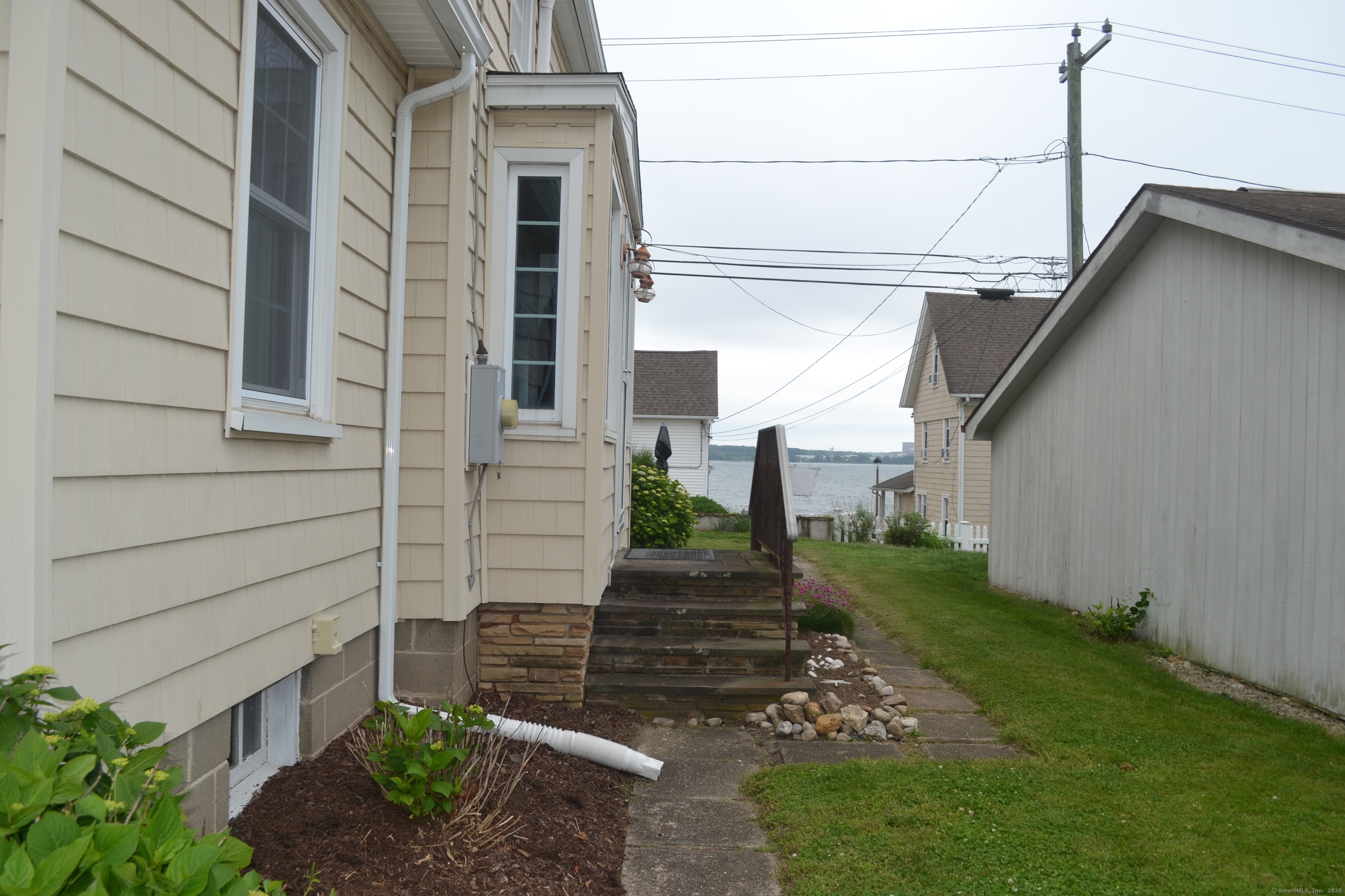 110 Columbus Avenue East Lyme, CT 06357 - Photo 3 of 24 a view of a pathway of house with an outdoor space