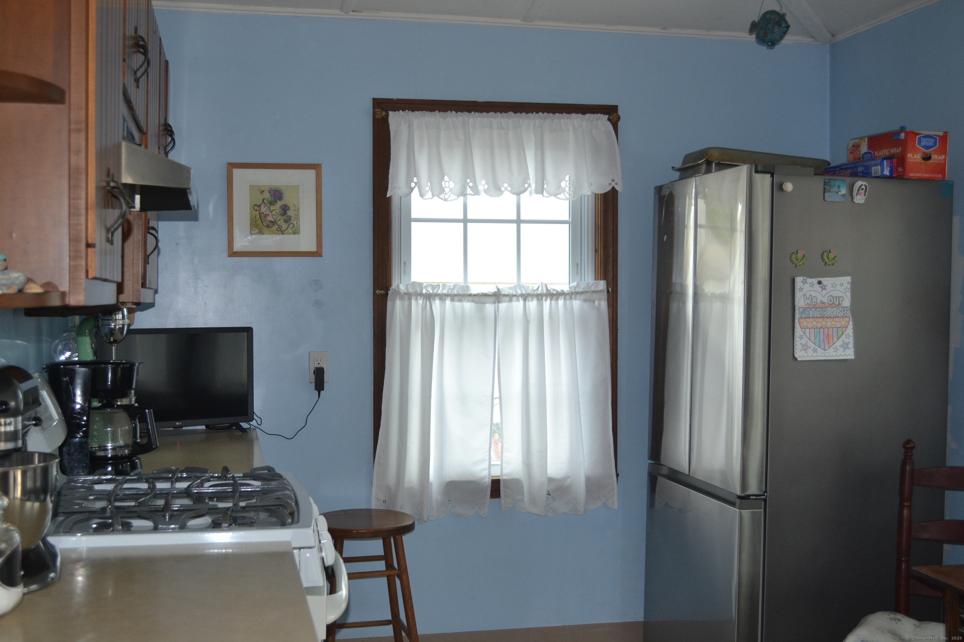 110 Columbus Avenue East Lyme, CT 06357 - Photo 6 of 24 a kitchen with stainless steel appliances granite countertop a refrigerator and a stove