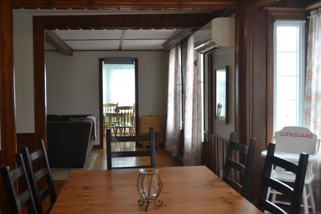 a view of a livingroom with furniture and windows