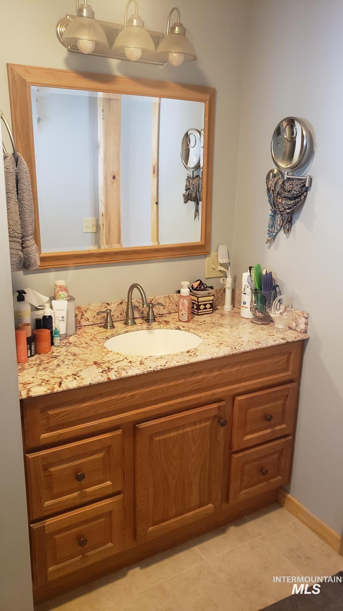 112 Three Forks Road Kamiah, ID 83536 - Photo 17 of 45 Bathroom with vanity and light tile patterned floors