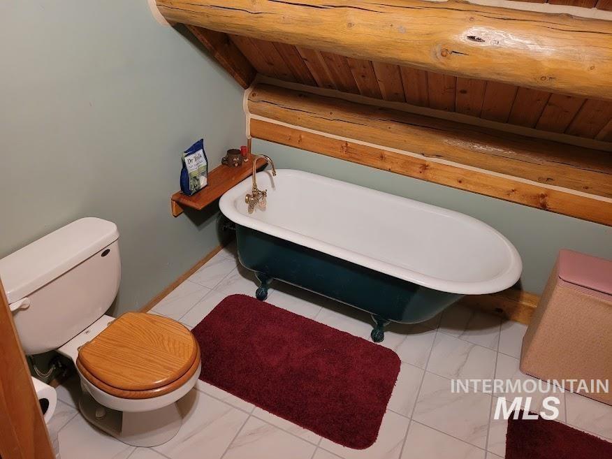 112 Three Forks Road Kamiah, ID 83536 - Photo 23 of 45 Full bathroom featuring toilet and a soaking tub