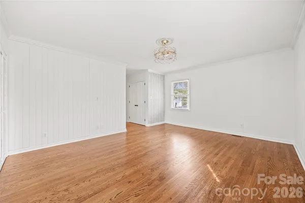 a view of an empty room and a window