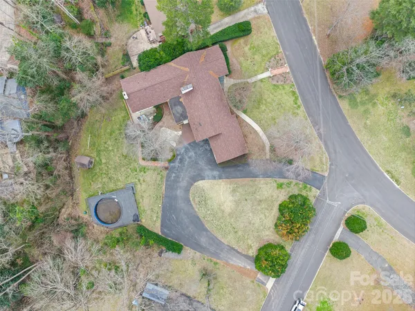 an aerial view of a house with outdoor space