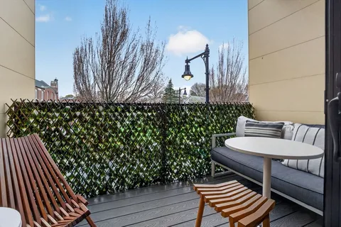 a balcony with wooden floor