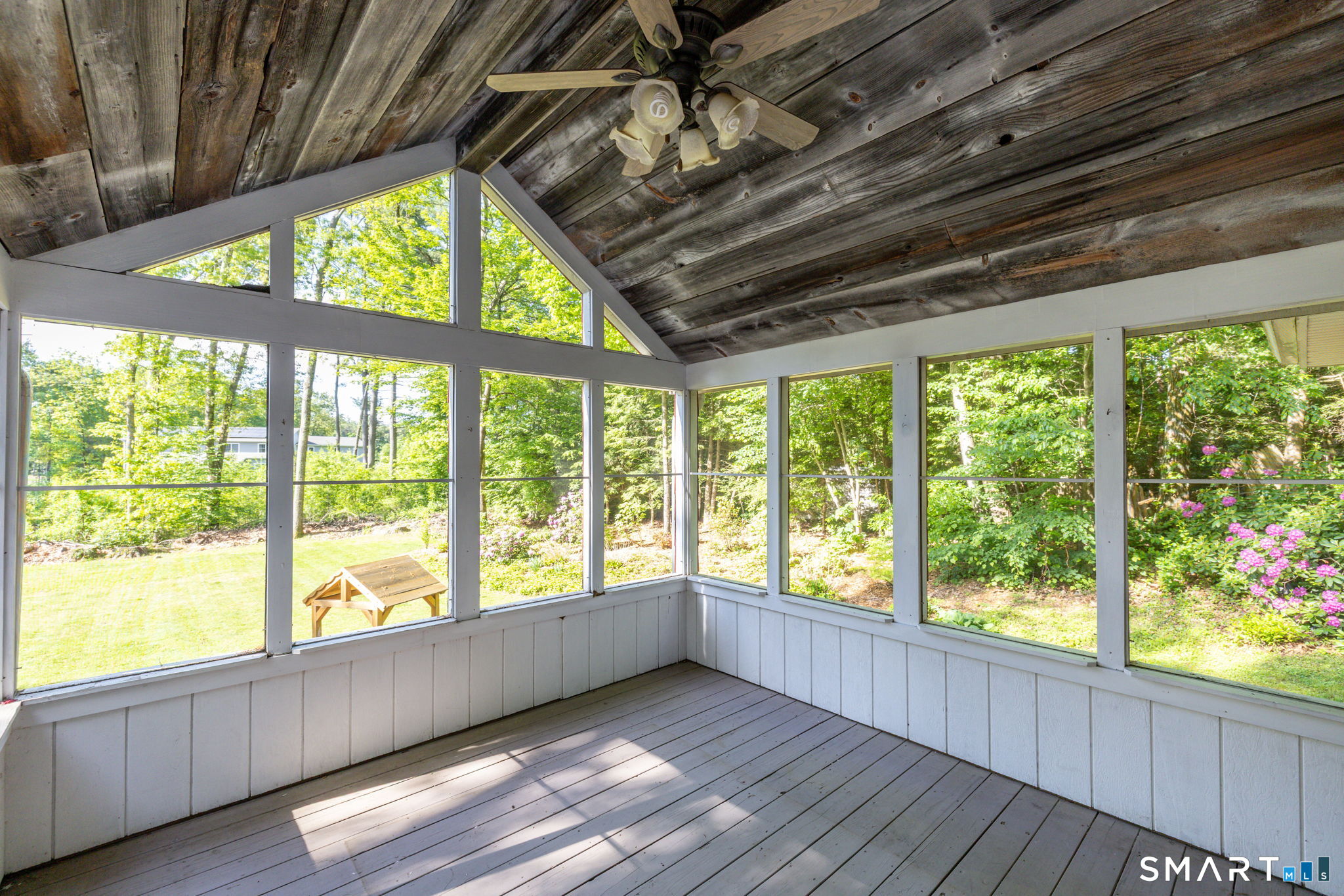 347 Griffin Road Suffield, CT 06093 - Photo 24 of 35 a view of an empty room with wooden floor and a window