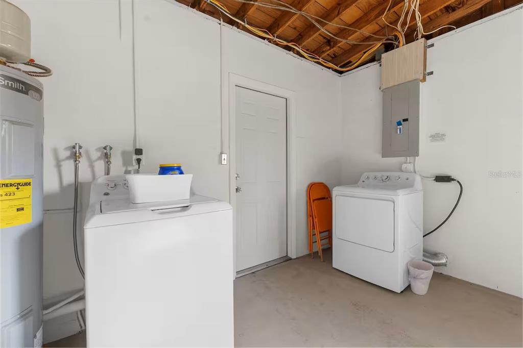 8215 Quail Road Seminole, FL 33777 - Photo 16 of 25 a utility room with dryer and washer