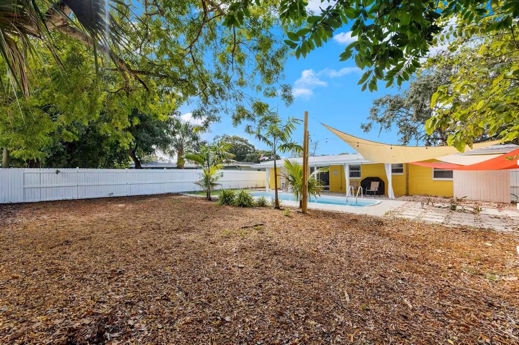 8215 Quail Road Seminole, FL 33777 - Photo 18 of 25 a view of a house with a yard