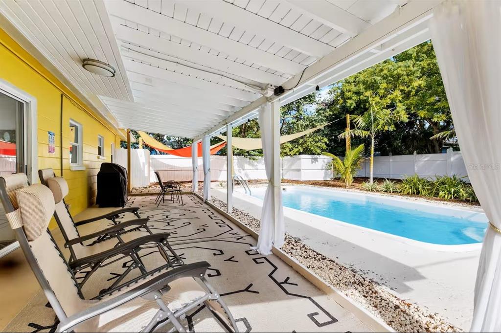 8215 Quail Road Seminole, FL 33777 - Photo 2 of 25 a very nice looking room with a large window