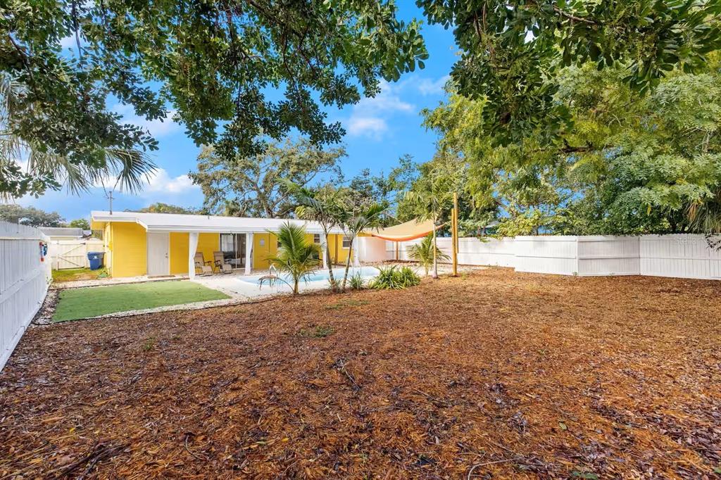 8215 Quail Road Seminole, FL 33777 - Photo 23 of 25 a view of a yard with a house