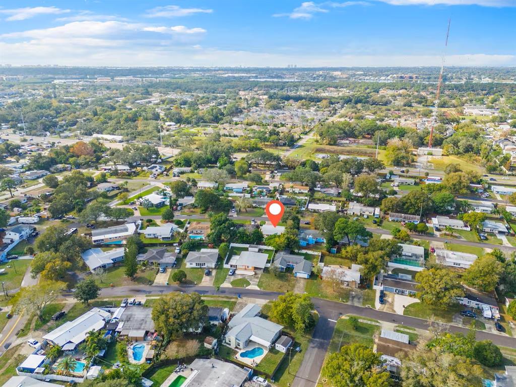 8215 Quail Road Seminole, FL 33777 - Photo 24 of 25 an aerial view of residential building with green space