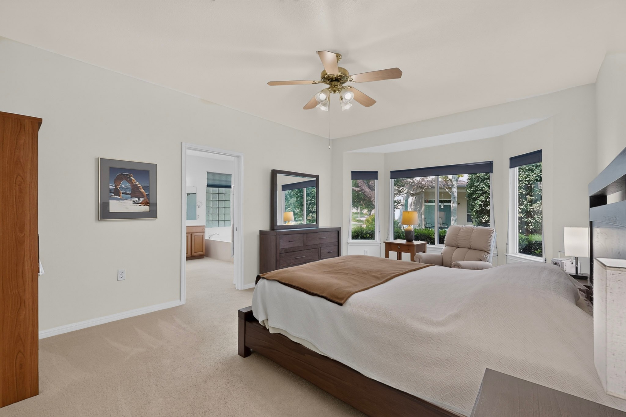 207 Red Poppy Trail Georgetown, TX 78633 - Photo 17 of 31 A quiet retreat with a cozy bedroom and an adjoining primary bathroom featuring a soaking tub.