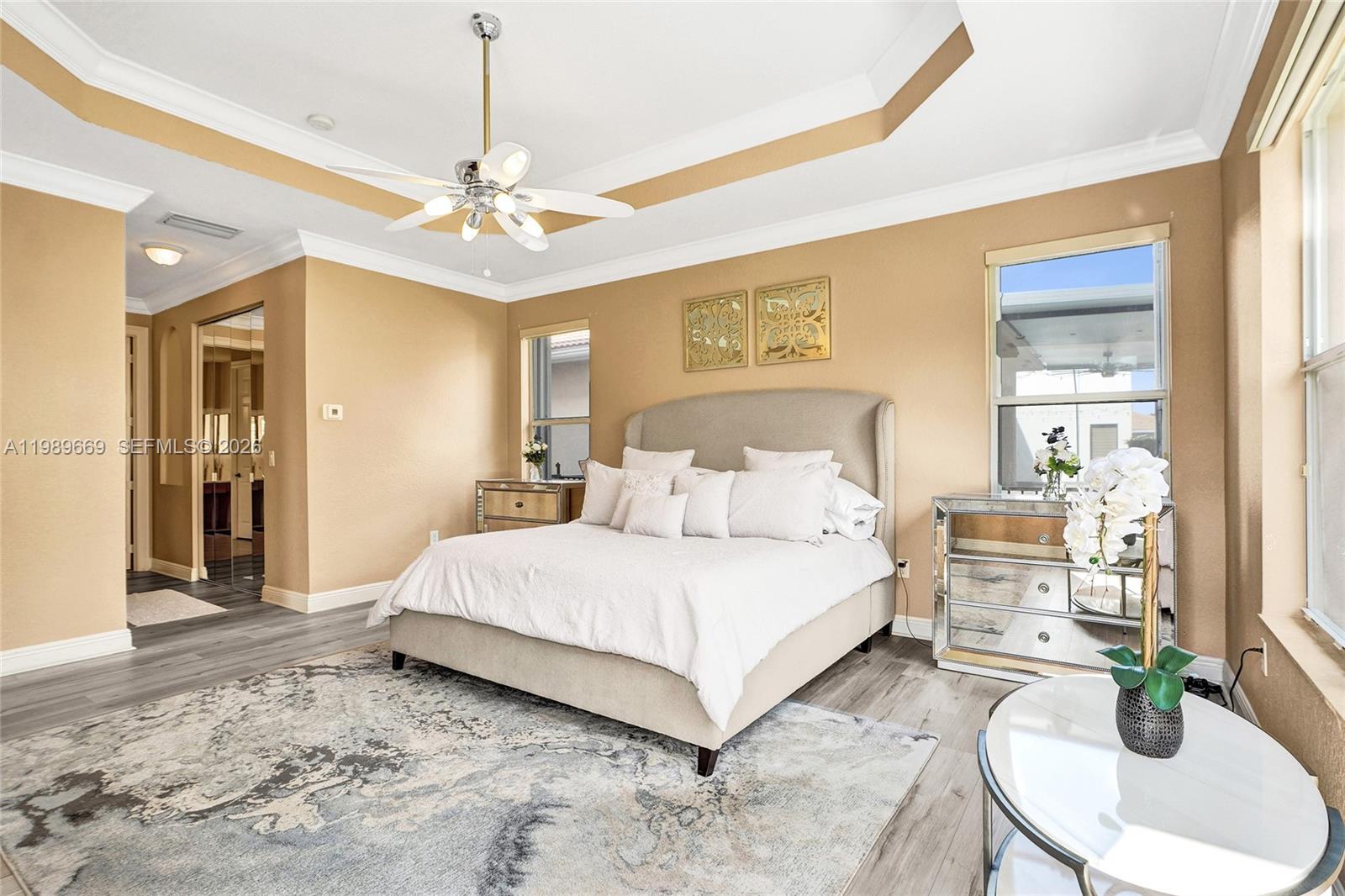 17713 Southwest 47th Street Miramar, FL 33029 - Photo 35 of 94 a bedroom with a large bed and ceiling fan
