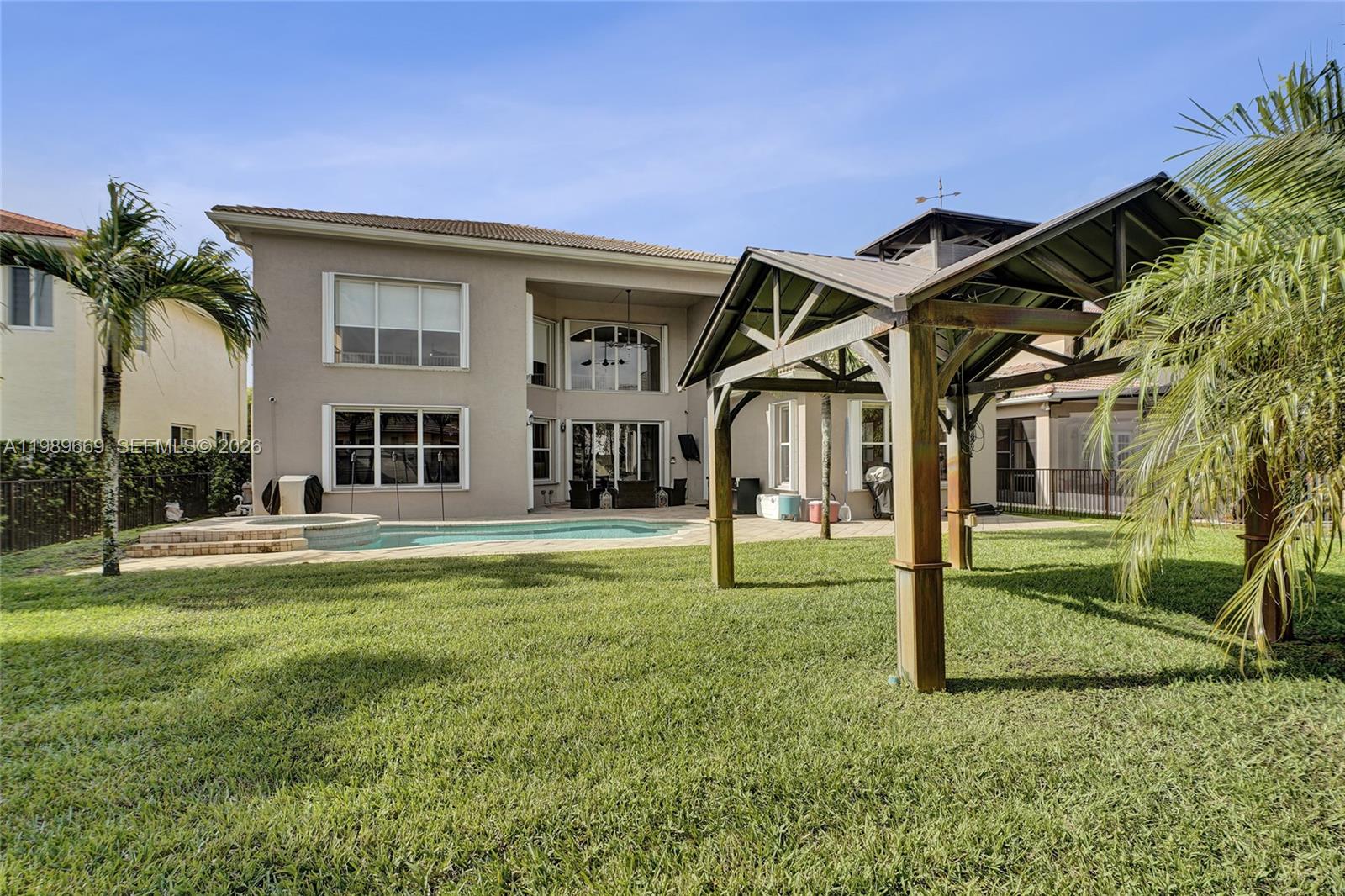 17713 Southwest 47th Street Miramar, FL 33029 - Photo 44 of 94 a front view of a house with a yard