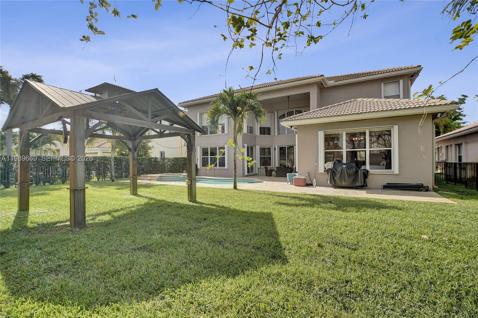 17713 Southwest 47th Street Miramar, FL 33029 - Photo 45 of 94 front view of a house with a yard