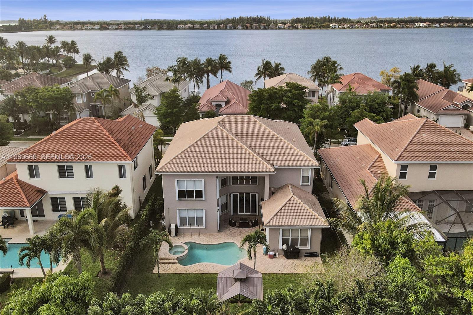 17713 Southwest 47th Street Miramar, FL 33029 - Photo 49 of 94 an aerial view of a house with garden space and lake view