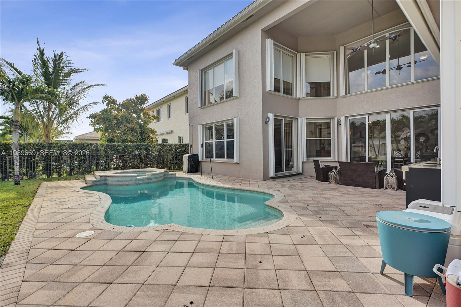 17713 Southwest 47th Street Miramar, FL 33029 - Photo 50 of 94 a swimming pool with yard outdoor seating and barbeque oven
