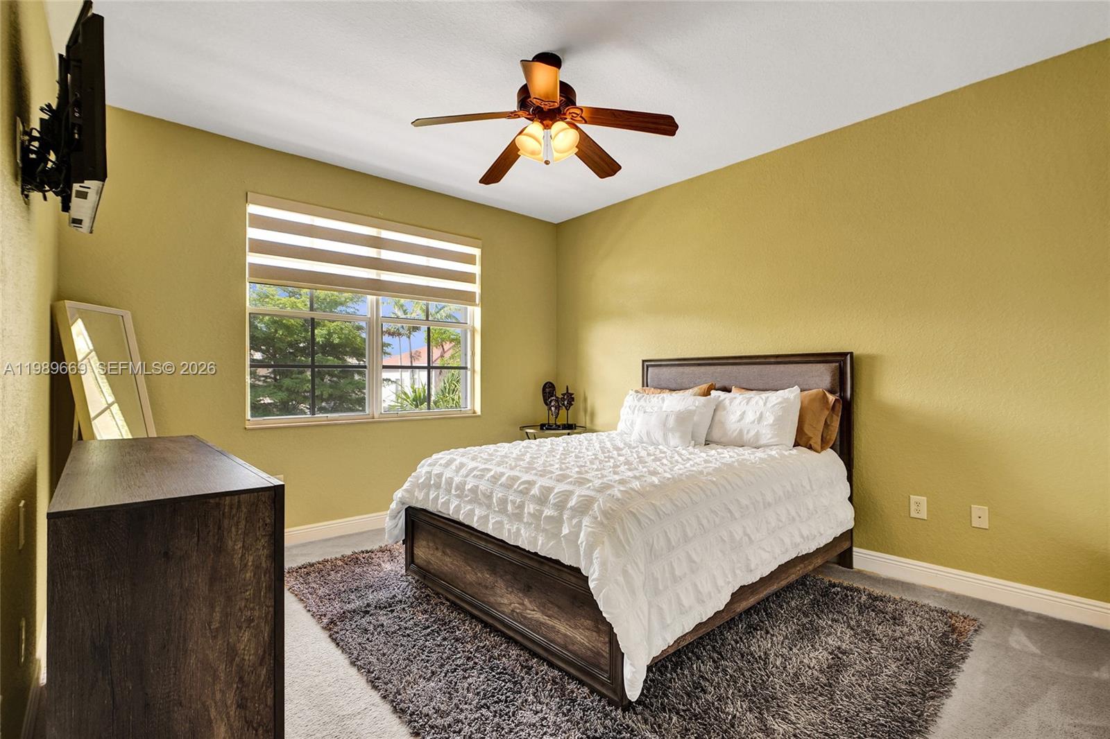 17713 Southwest 47th Street Miramar, FL 33029 - Photo 56 of 94 a bedroom with a bed and window