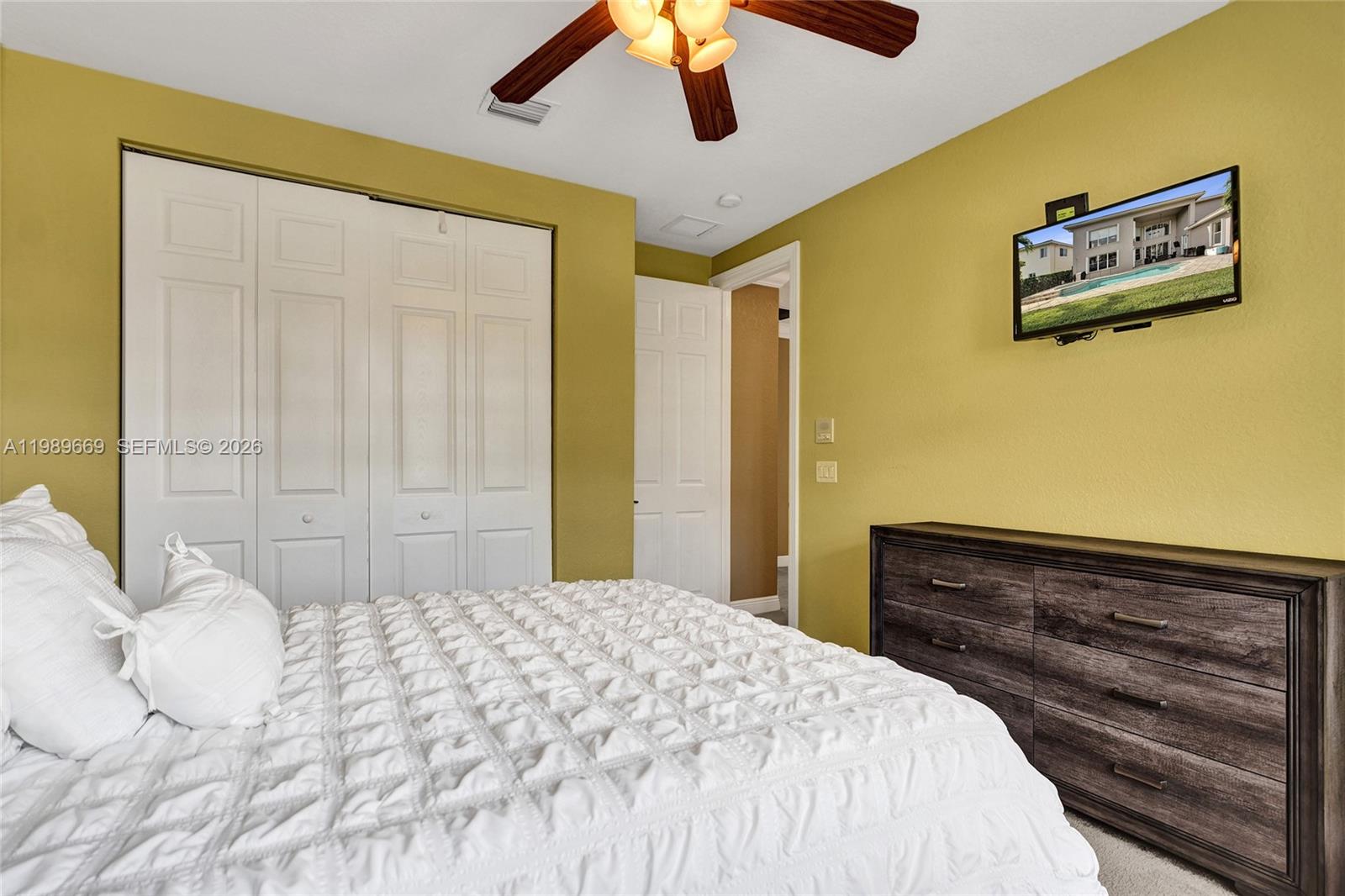 17713 Southwest 47th Street Miramar, FL 33029 - Photo 59 of 94 a bedroom with a bed and lamp