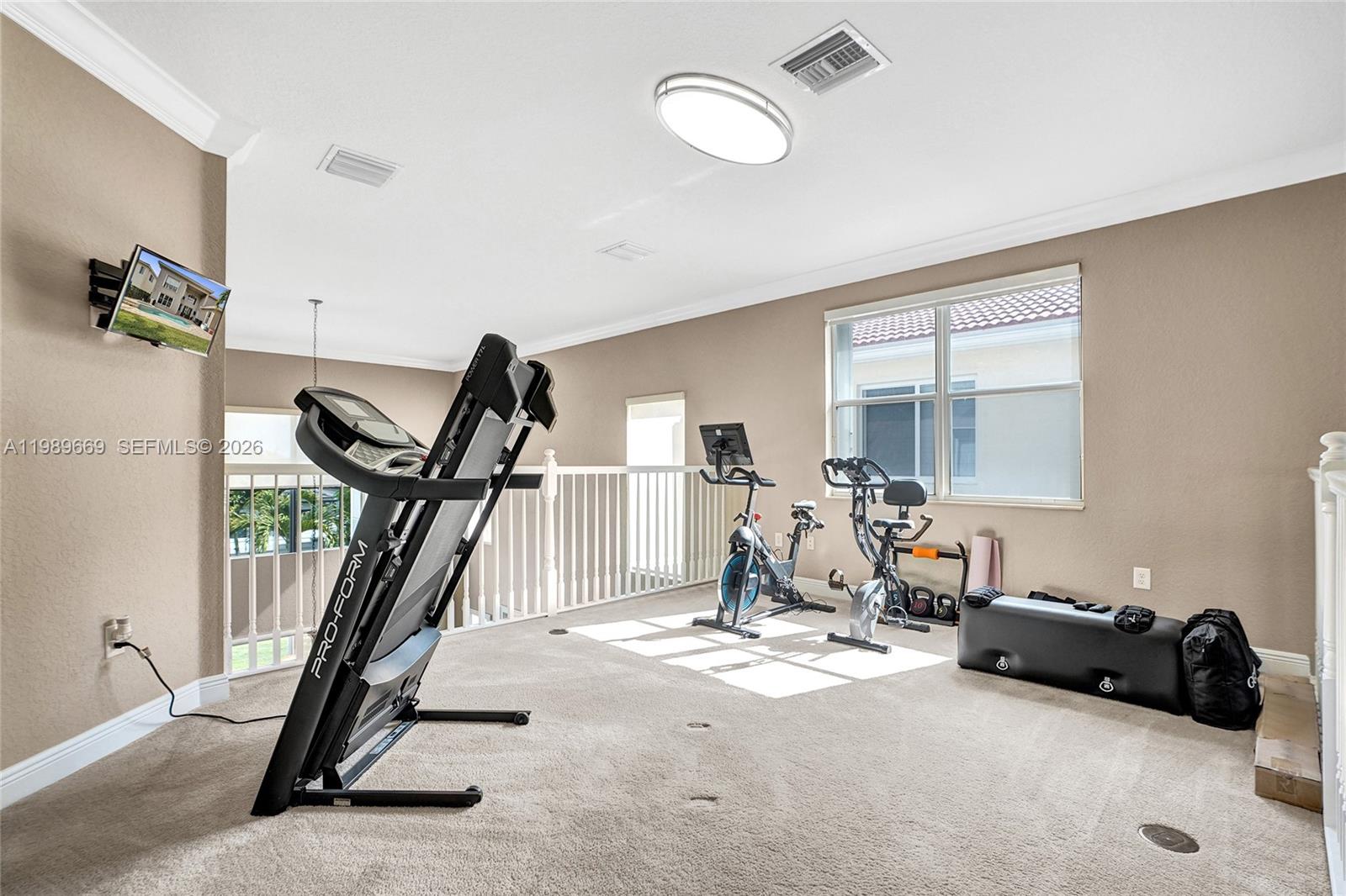 17713 Southwest 47th Street Miramar, FL 33029 - Photo 64 of 94 a view of a room with gym equipment