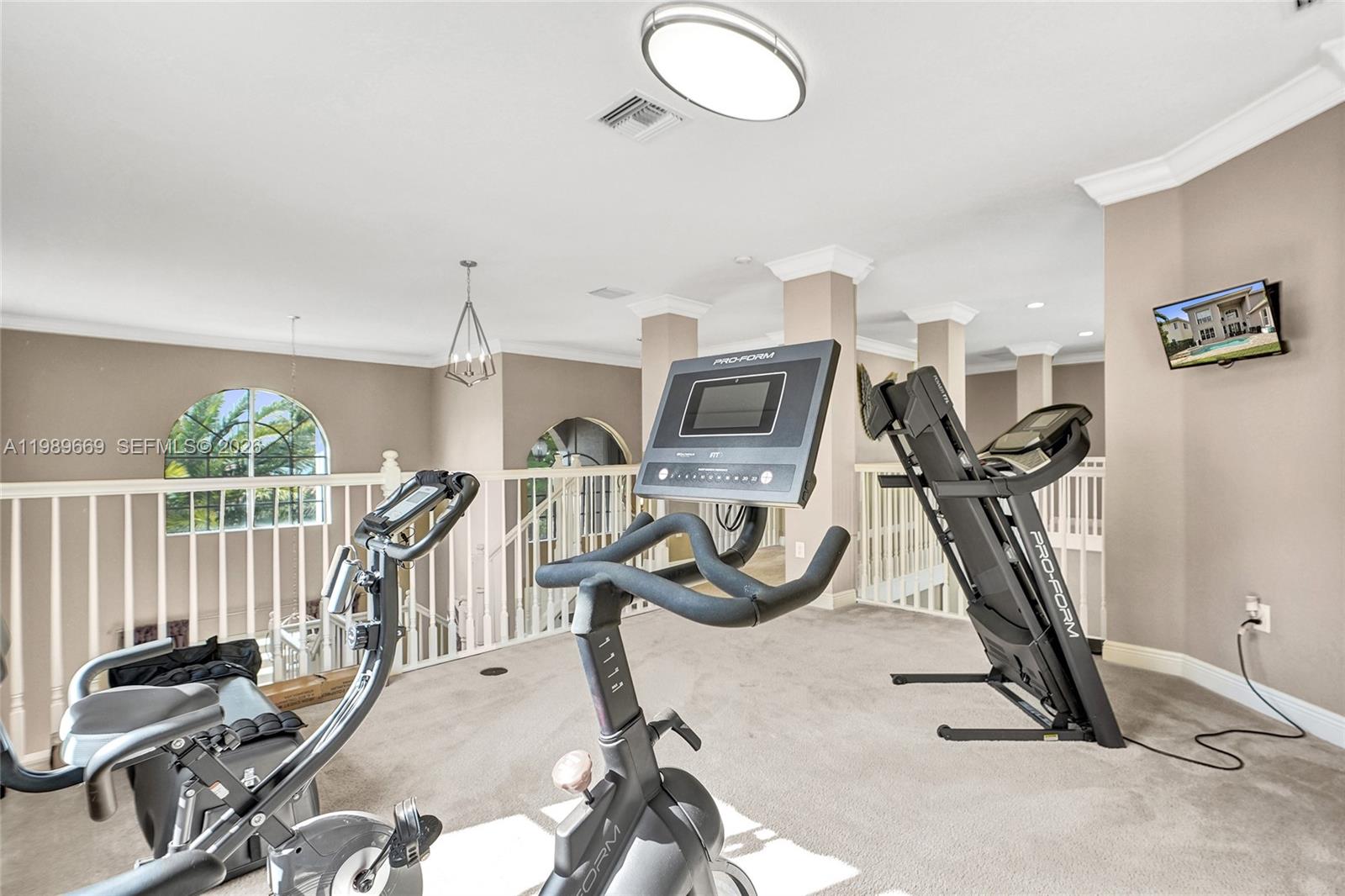17713 Southwest 47th Street Miramar, FL 33029 - Photo 68 of 94 a view of a room with gym equipment