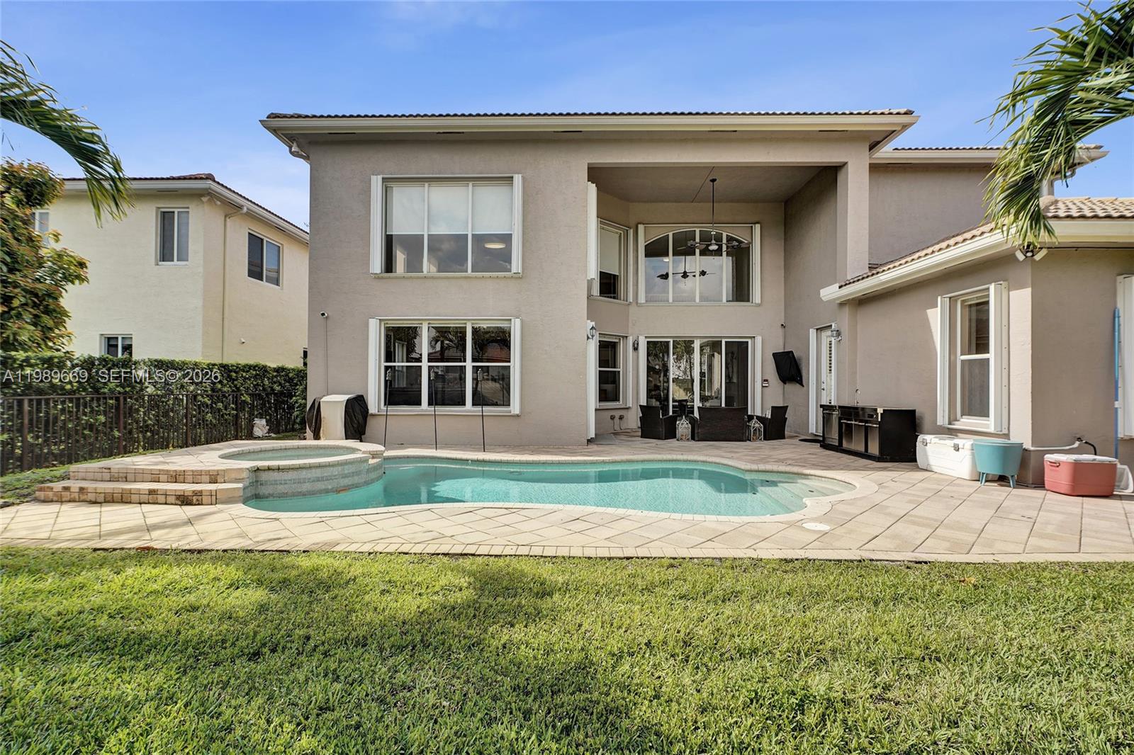 17713 Southwest 47th Street Miramar, FL 33029 - Photo 81 of 94 a house view with swimming pool in front of it