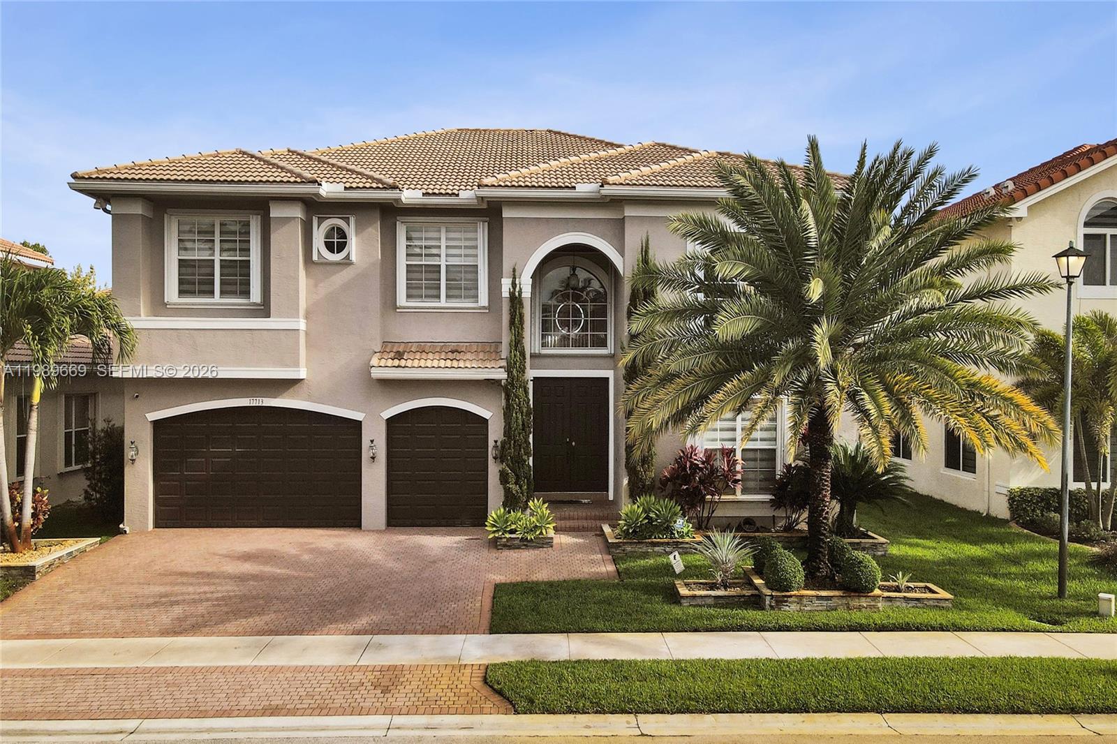 17713 Southwest 47th Street Miramar, FL 33029 - Photo 85 of 94 a front view of a house with a yard