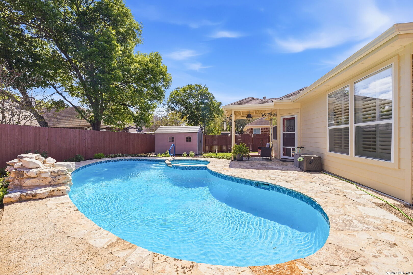 a view of a swimming pool with a lounge chairs
