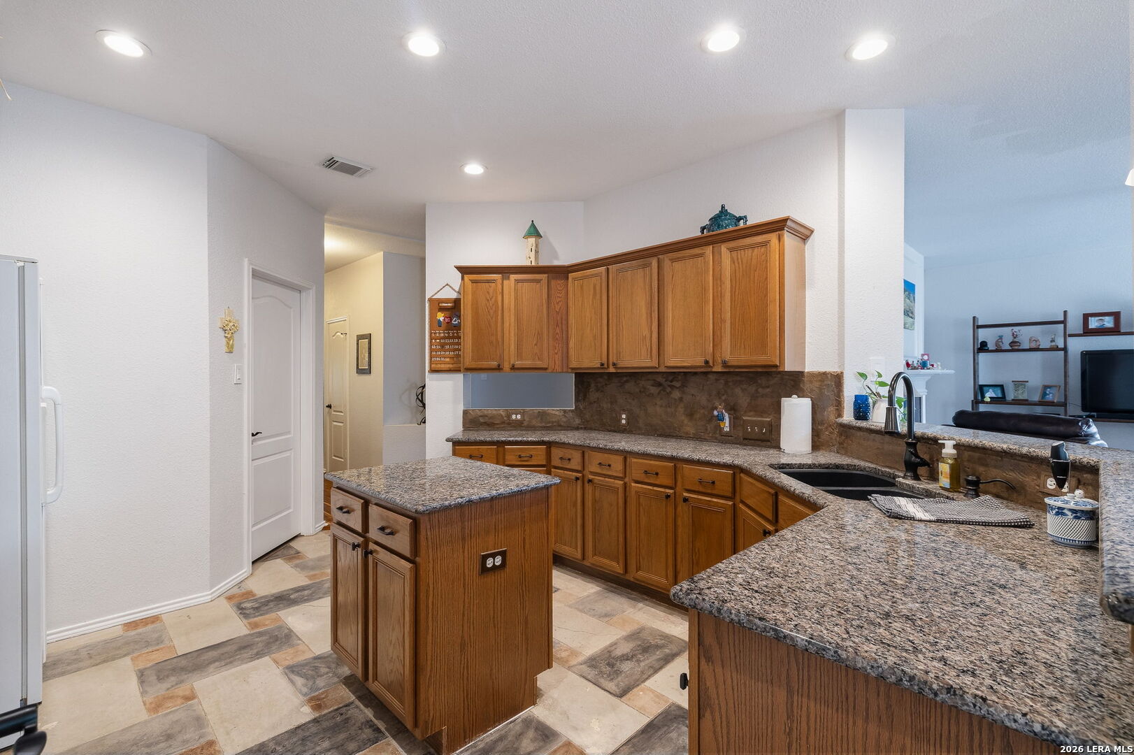 229 Notch Leaf Cibolo, TX 78108 - Photo 15 of 30 a kitchen with stainless steel appliances granite countertop a sink stove and refrigerator