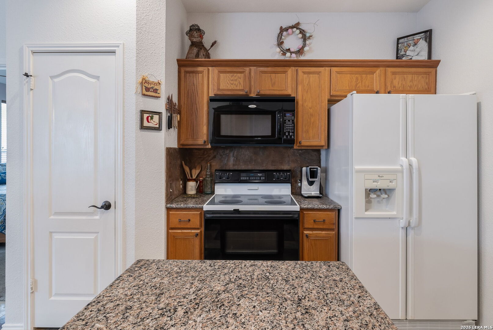 229 Notch Leaf Cibolo, TX 78108 - Photo 18 of 30 a kitchen with a stove and a microwave