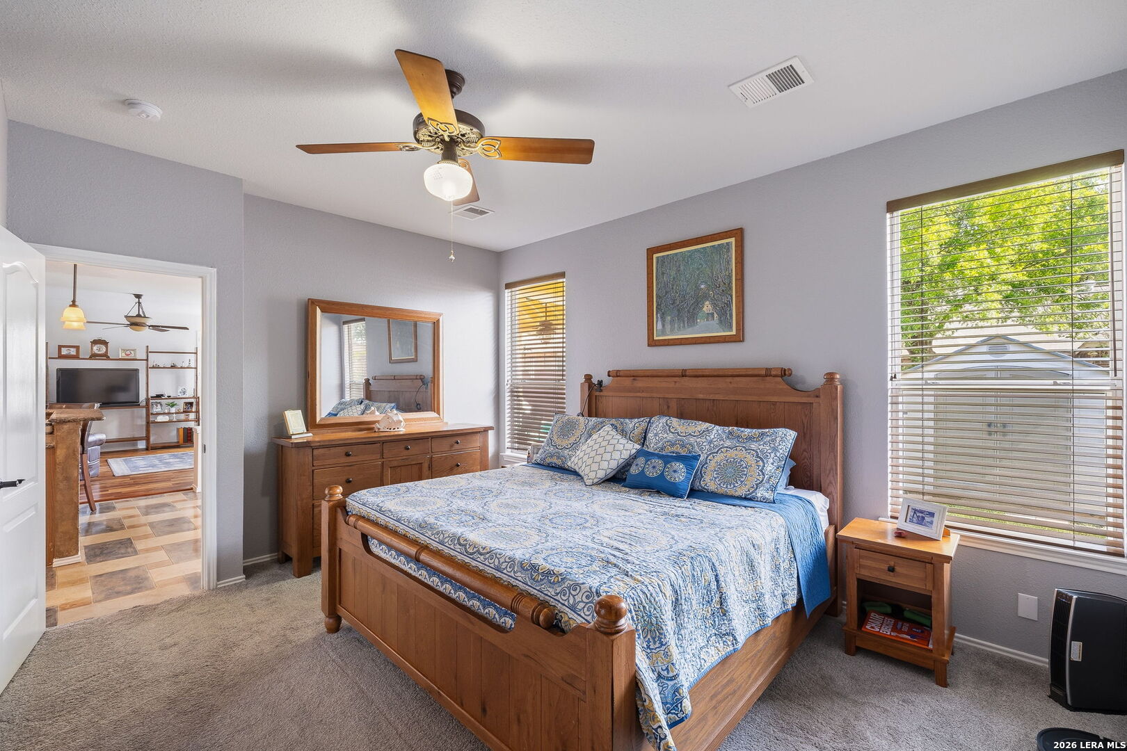 229 Notch Leaf Cibolo, TX 78108 - Photo 19 of 30 a bedroom with a bed and a chandelier