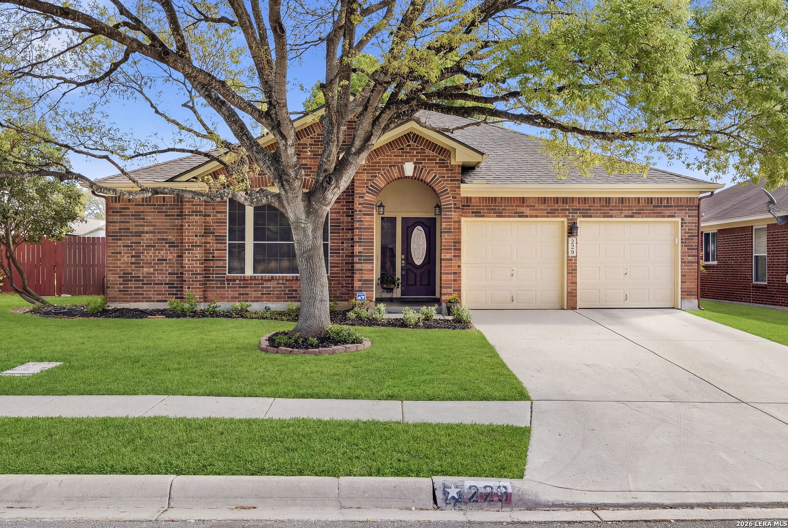 229 Notch Leaf Cibolo, TX 78108 - Photo 2 of 30 a front view of a house with a garden