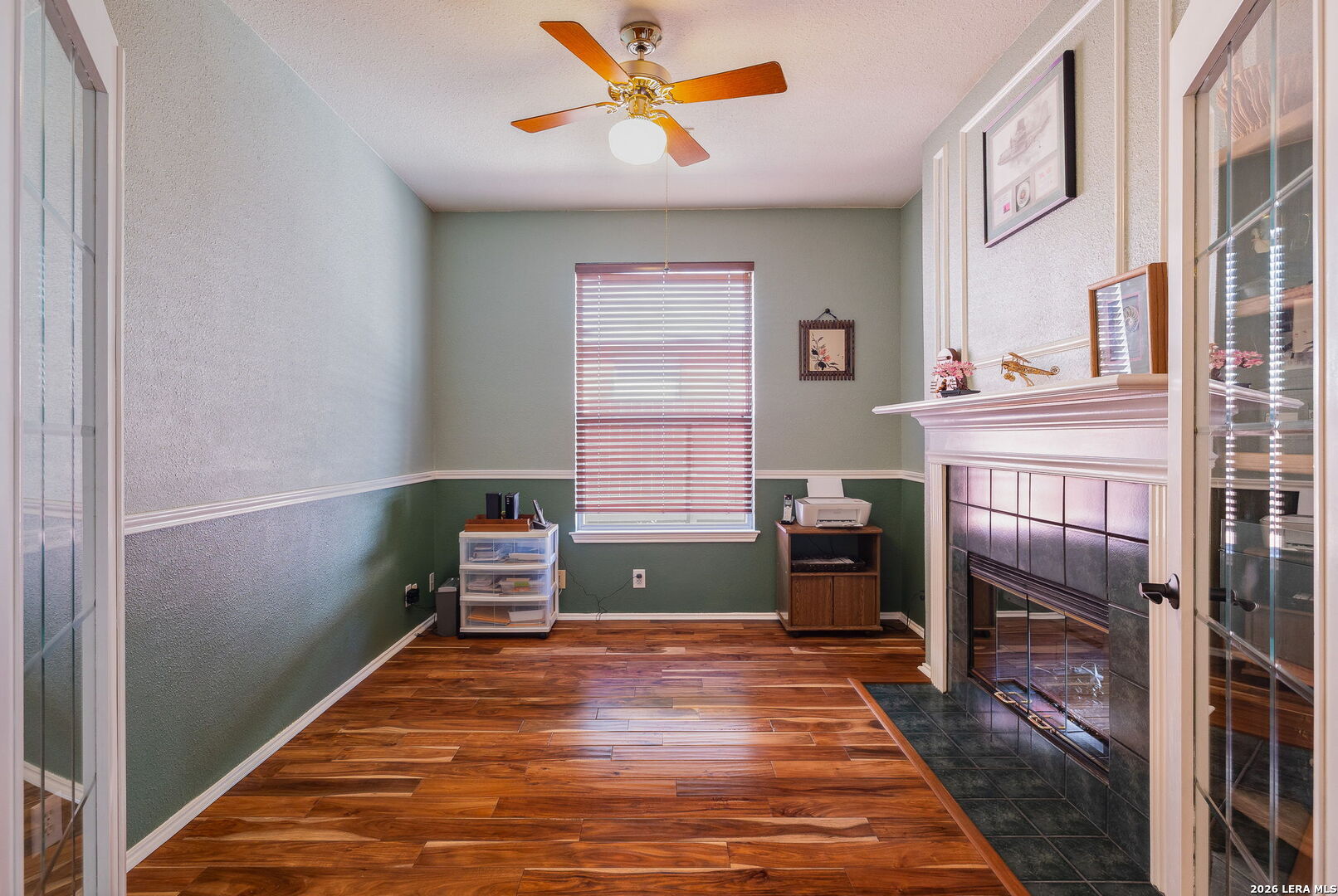 229 Notch Leaf Cibolo, TX 78108 - Photo 22 of 30 a bedroom with a bed and a fireplace
