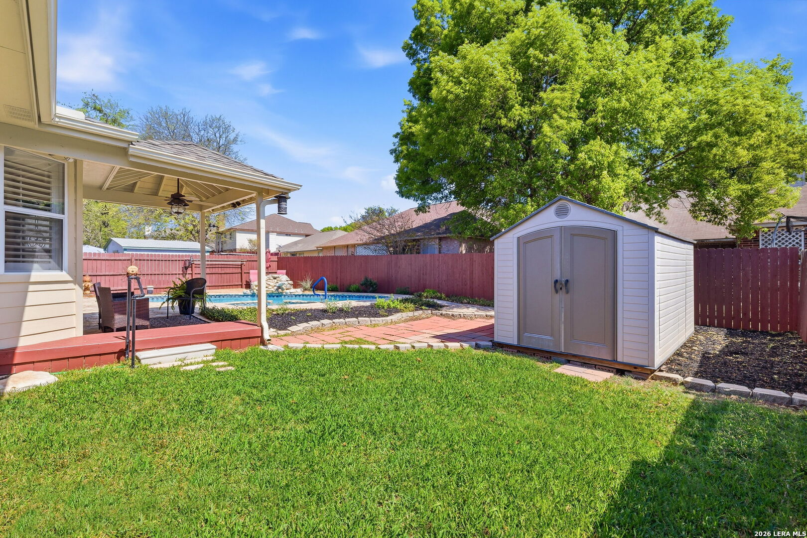 229 Notch Leaf Cibolo, TX 78108 - Photo 30 of 30 a view of a backyard with table and chairs under an umbrella