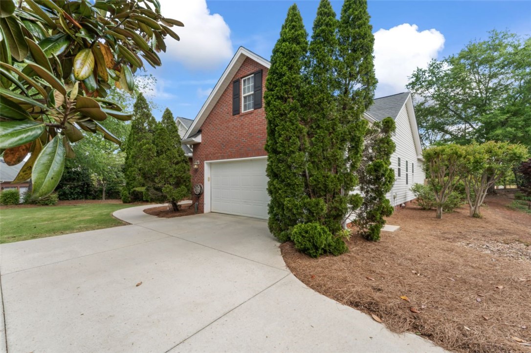 409 Arbor Way Seneca, SC 29672 - Photo 2 of 48 Driveway with side pullover space towards Dbl Gara