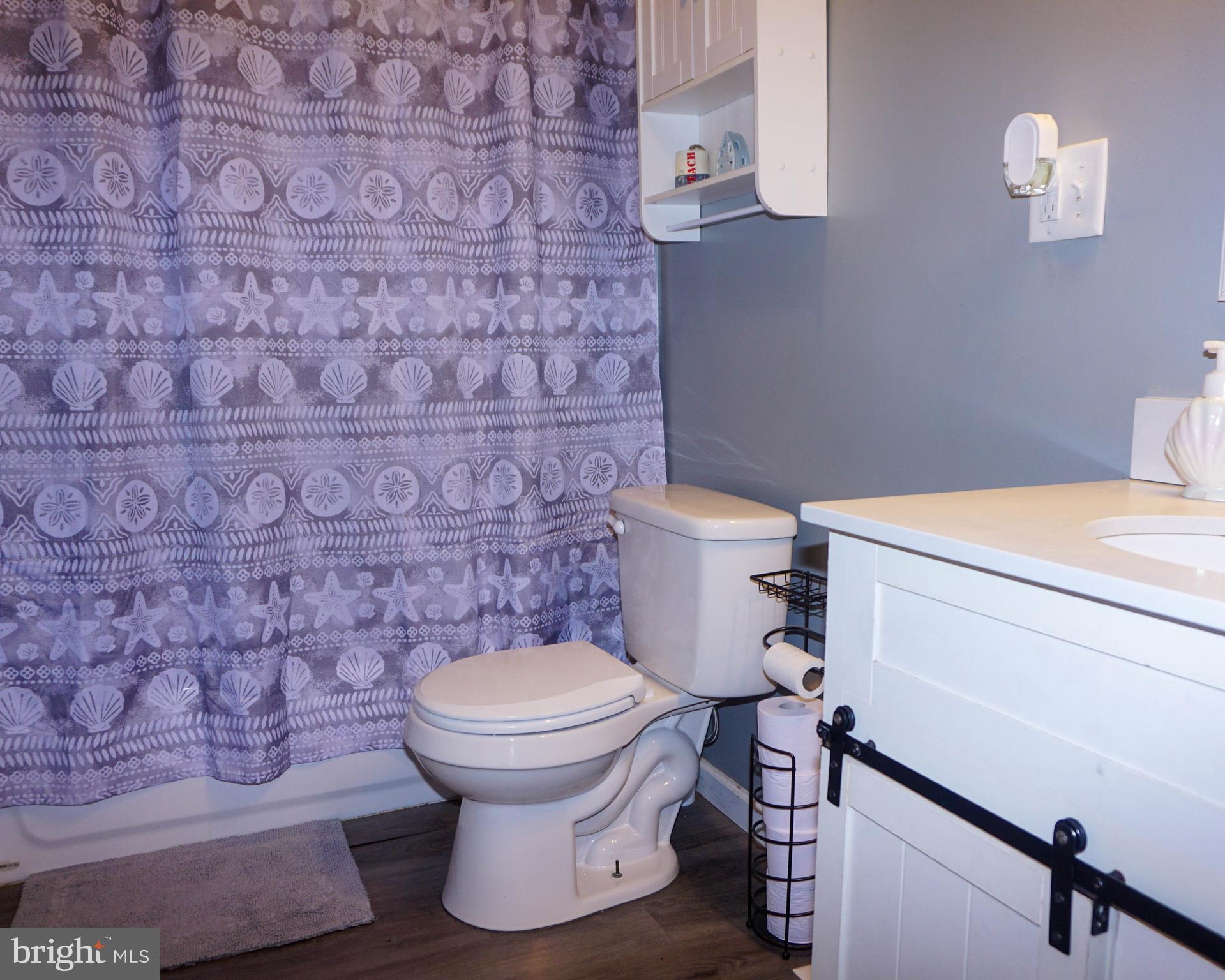 91 Mt Clement Avenue Pine Hill, NJ 08021 - Photo 15 of 27 a bathroom with a toilet and a sink