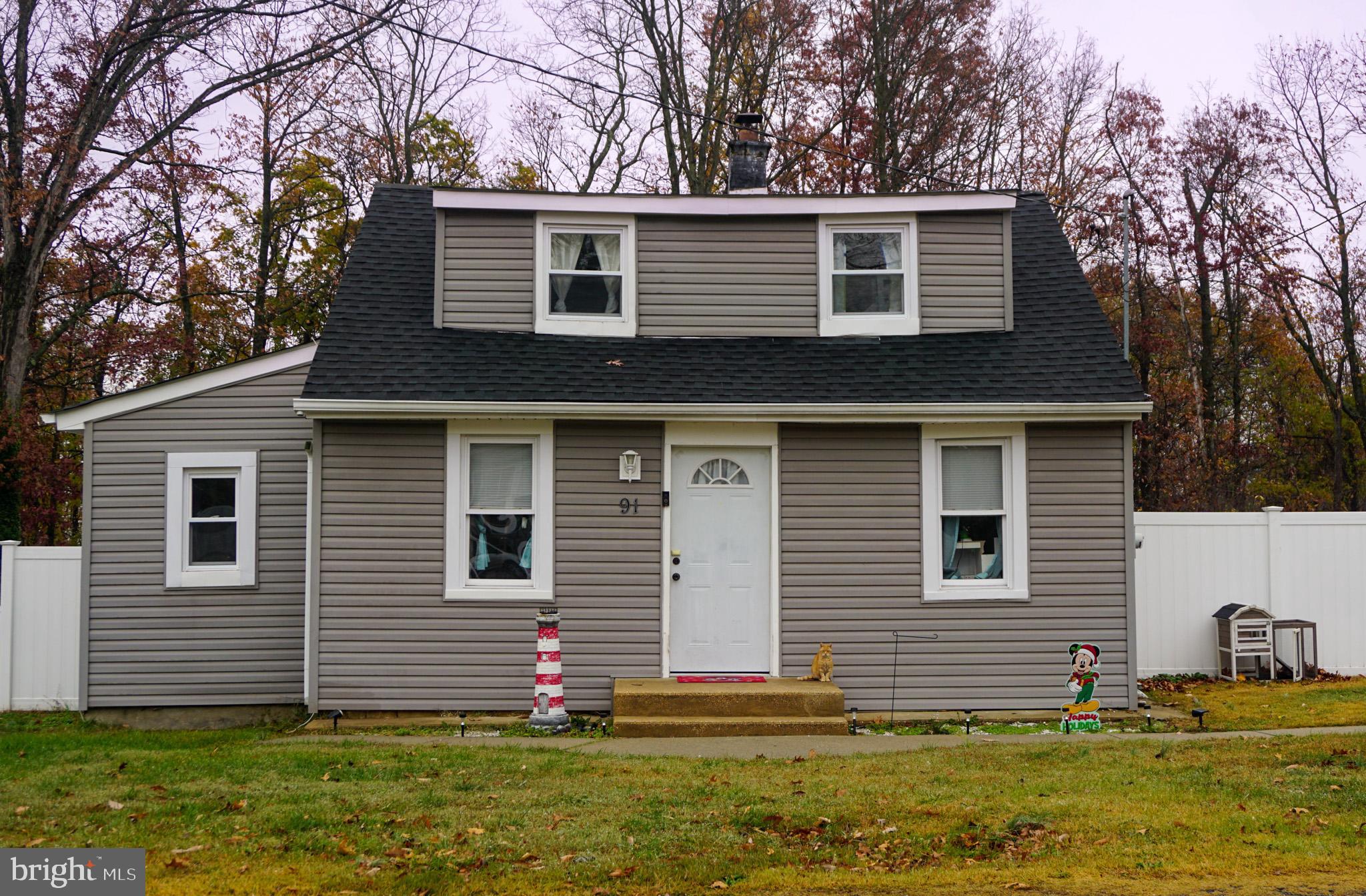 91 Mt Clement Avenue Pine Hill, NJ 08021 - Photo 2 of 27 a front view of a house with a yard and garage